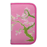 Grüner Baum mit rosa Smartphonefolioplaner