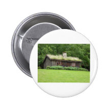 Haus mit Grasdach Anstecknadelbutton