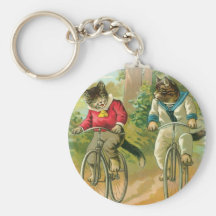 Katzen, die Fahrräder reiten Schlüsselband