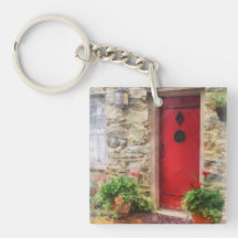 Pelargonien durch rote Tür Schlüsselanhängern