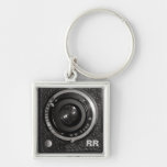 Vintages Kameraobjektiv auf einem Keychain Schlüsselband