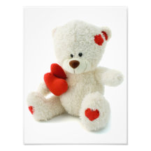 Weißer Teddybär, der ein rotes Herz hält Foto