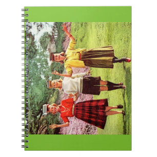 1960 Mädchen im Teenageralter mit Büchern auf dem  Notizblock