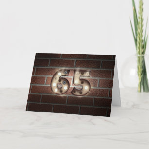 65. Geburtstagslichter an der Backsteinwand Karte