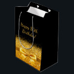 80th birthday black gold clasic elegant monogram mittlere geschenktüte<br><div class="desc">Elegant,  classic,  glamorous and feminine style party gift bag.  A gold colored ribbon and bow with golden glitter and sparkle,  a bit of bling and luxury for a birthday.  Black background. Text; Happy 80th Birthday!</div>