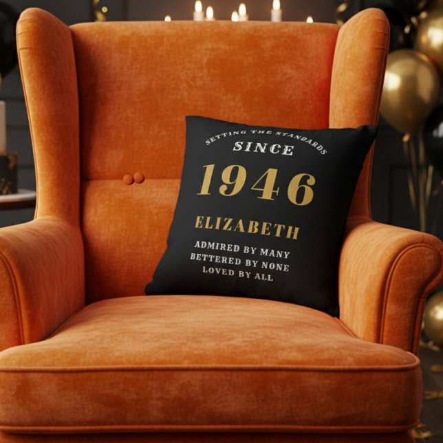 80th Birthday Gift Personalized 1946 Black Gold Kissen (A vibrant orange velvet wingback armchair with a black throw pillow for an 80th birthday celebration)