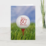 80th Birthday Golf Ball Karte<br><div class="desc">Close up of a white golf ball on a red tee in grass with sky background for 80th birthday.</div>