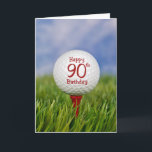 90. Geburtstags-Golfball Karte<br><div class="desc">Nah oben von einem weißen Golfball auf einem roten T-Stück im Gras mit Himmelhintergrund für 90. Geburtstag.</div>