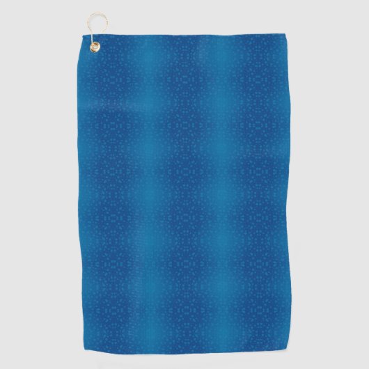 A blue towel with a subtle dotted pattern hangs  golfhandtuch (Vorderseite)