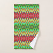 A colorful, geometric-patterned towel set hangs (Handtuch)
