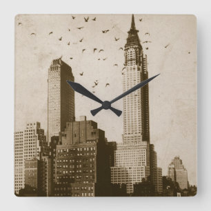 A flock of birds flying quadratische wanduhr