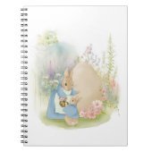 A mother rabbit with a baby rabbit in a clearing w notizblock (Vorderseite)