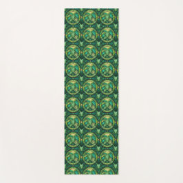 A pattern of intricate, green and gold circular  yogamatte