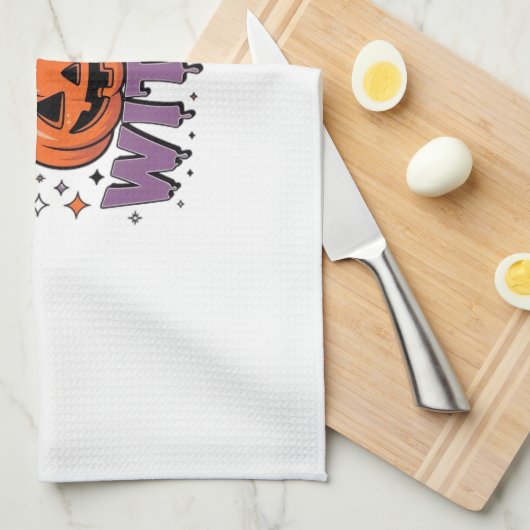 A playful design featuring a pumpkin witch with a geschirrtuch (Viertel Falte)