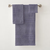 A set of purple towels with a diamond pattern