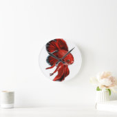 A vibrant red betta fish swimming. runde wanduhr (Zuhause)