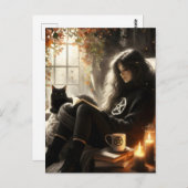 A witch reads with her black cat in a cozy chair postkarte (Vorne/Hinten)