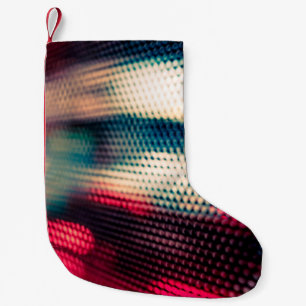 abstract background with bokeh defocused lights an kleiner weihnachtsstrumpf