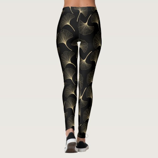 Abstrakte Blätter aus Schwarz und Leichtgold Leggings (Rückseite)