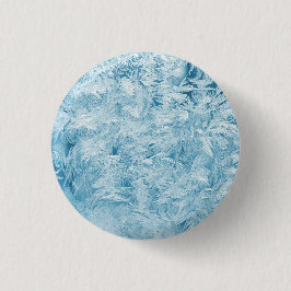 abstrakte blaue Federn und Schneeflocken Button