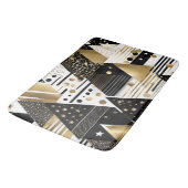 abstrakte Dreiecksbadematte aus Gold und Schwarz Badematte (Schrägansicht)