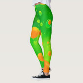 Abstrakte Kunst in orangefarbener und grüner Blase Leggings (Links)