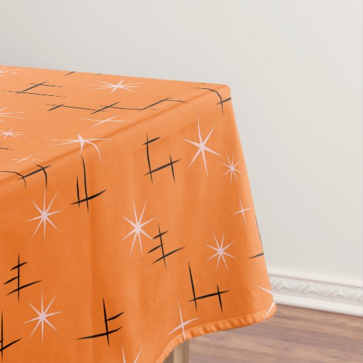 Abstrakte Linien und rosa Sterne auf orange Retro Tischdecke (Beispiel)