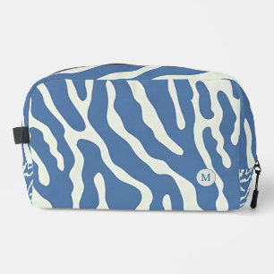 Abstrakte Wavy Lines in Blau und Creme bilden eine Waschbeutel