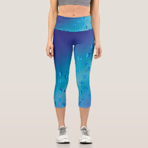 Abstrakter Blauer Mond und Schmetterlinge Capri Leggings