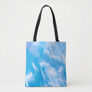 Abstrakter Glitzer leuchtet auf blauem Hintergrund Tasche