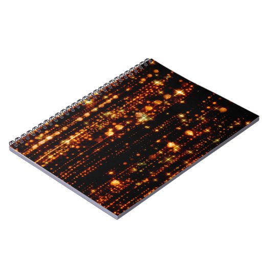 Abstrakter Goldregen mit hellen Partikeln mit Flac Notizblock (Linke Seite)