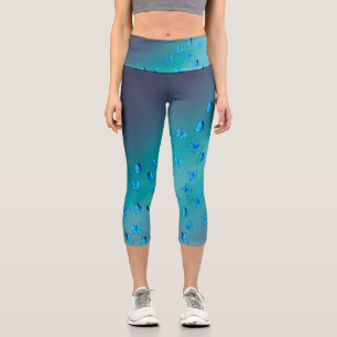Abstrakter Grünmond und Schmetterlinge Capri Leggings