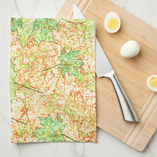 Abstraktes Acerblatt auf zerkratztem Boden, beige Geschirrtuch (Viertel Falte)