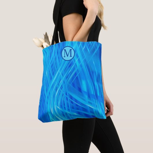 Abstraktes Muster-Monogramm mit wirbelndem blauem Tasche (Von Nahem)