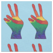 Abstraktes Regenbogen-Friedenshand-Zeichen auf maß Stoff (Nahaufnahme)