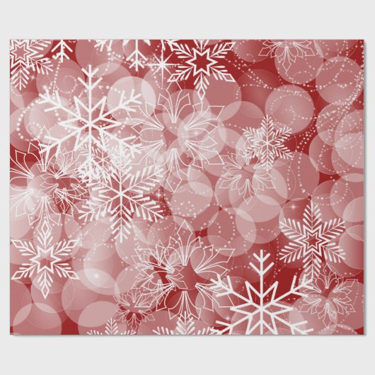 Abstraktes rotes Muster mit weißen Schneeflocken Geschenkpapier (Flach)