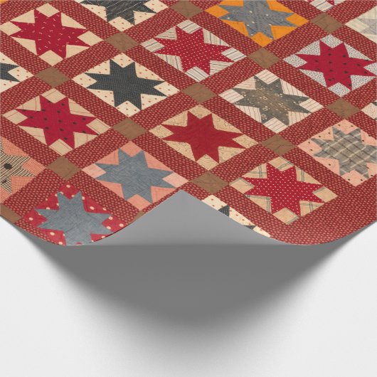 Acht gepunkteter Stern in warmen Farben Geschenkpapier (Ecke)