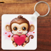Adorable Baby Monkey hält ein rotes Herz Schlüsselanhänger (Rückseite)