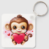Adorable Baby Monkey hält ein rotes Herz Schlüsselanhänger (Rückseite)