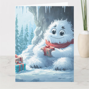 Adorable Yeti mit Weihnachtsgeschenken in einer Hö Karte