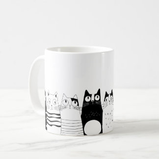 Adortable Katze sitzend Kaffeetasse