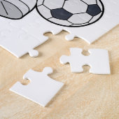 Affe als Fußballspieler mit Fußball Puzzle (Seite)