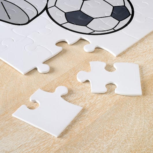 Affe als Fußballspieler mit Fußball Puzzle (Seite)