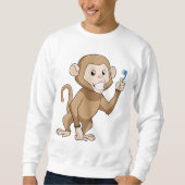 Affe mit Zahnbürste Sweatshirt (Vorderseite)