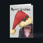 Affe-Sankt-Weihnachten Feiertagskarte<br><div class="desc">Lustige Weihnachtskarte mit einem lachenden Affen,  der eine rote Weihnachtsmannmütze trägt. Ist oben kundengerechter Text "frohe Weihnachten" im sehr schlechten Drucken. Innerhalb ist ein Platz für kundengerechteren Text.</div>