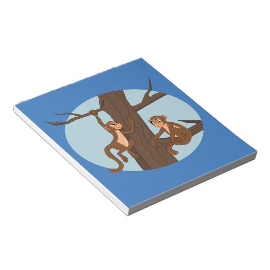 Affen klettern auf den Cartoon-Notizblock Notizblock (angewinkelt)