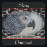 African Gray Snowy Christmas Quadratischer Aufkleber<br><div class="desc">Nah von einem atemberaubenden Afrikanischen Grau Papagei Profil vor einem Schwarz-Weiß-Winterwunderland von Schnee mit Kiefern und Tannen Hintergrund. Perfekte Weihnachtsgrüße für den Tier- und Vogelliebhaber in Ihnen!</div>