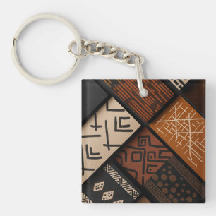 afrikanische Kulturdesigns auf diagonalen Formen Schlüsselanhänger