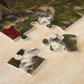 Afrikanisches Grau des Kongos auf einem Schwingen Puzzle (Seite)