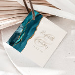 Agate Geode Script Aquamarin Gold Ivory Wedding Geschenkanhänger<br><div class="desc">Dieses elegante, moderne Gastgeschenk Hochzeit-Tag zeichnet sich durch ein aquamarines Aquarelldesign aus, das mit Imitaten vergoldeten Glitzer besticht. Der goldfarbene Text auf Elfenbeinhintergrund lässt sich leicht anpassen, wobei die Namen der Braut und des Bräutigams in handschriftlicher Kalligraphie über einen großen Ampersand verteilt sind. Fügen Sie auf der Rückseite eine persönliche...</div>